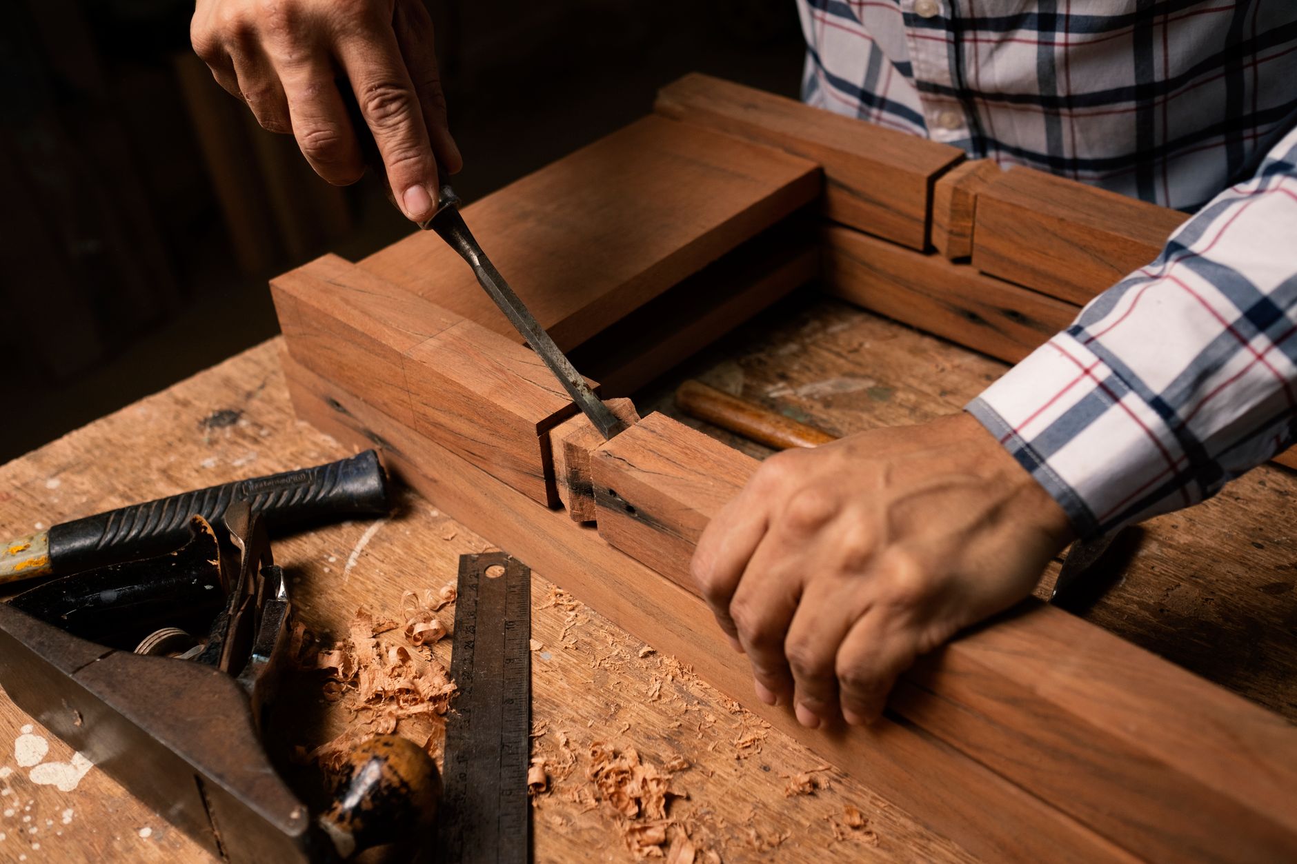 Hand tools arranged on a home workbench