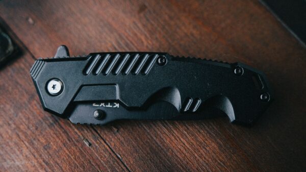Best pocket knife: a folding knife resting on a table
