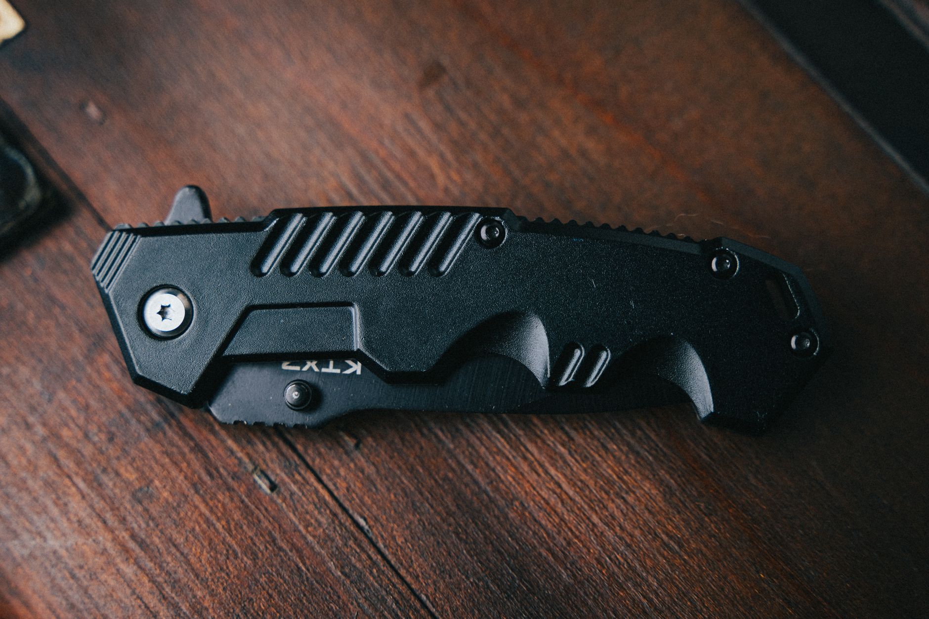 Best pocket knife: a folding knife resting on a table
