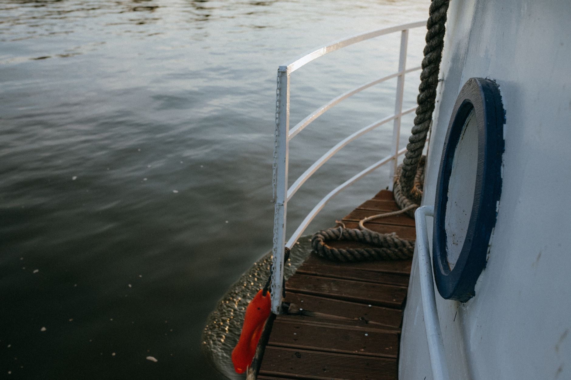 A boat railing over the water