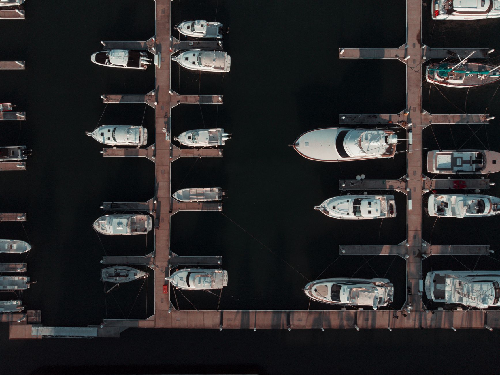Boats docked at a marina from above