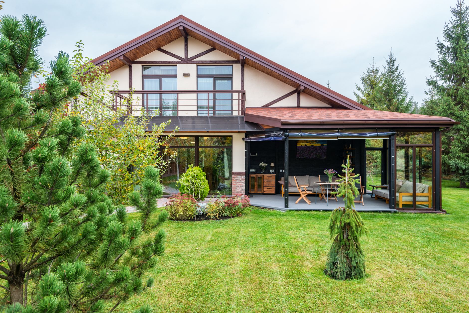 A house with a large lawn and covered porch