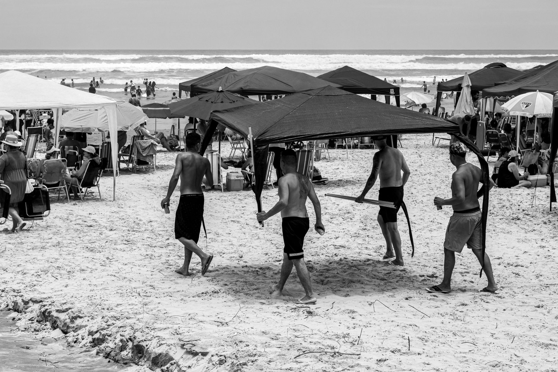 A canopy tent providing shade on a beach