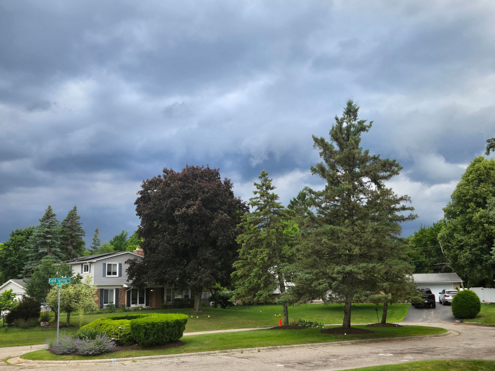 Storm clouds over a suburban street