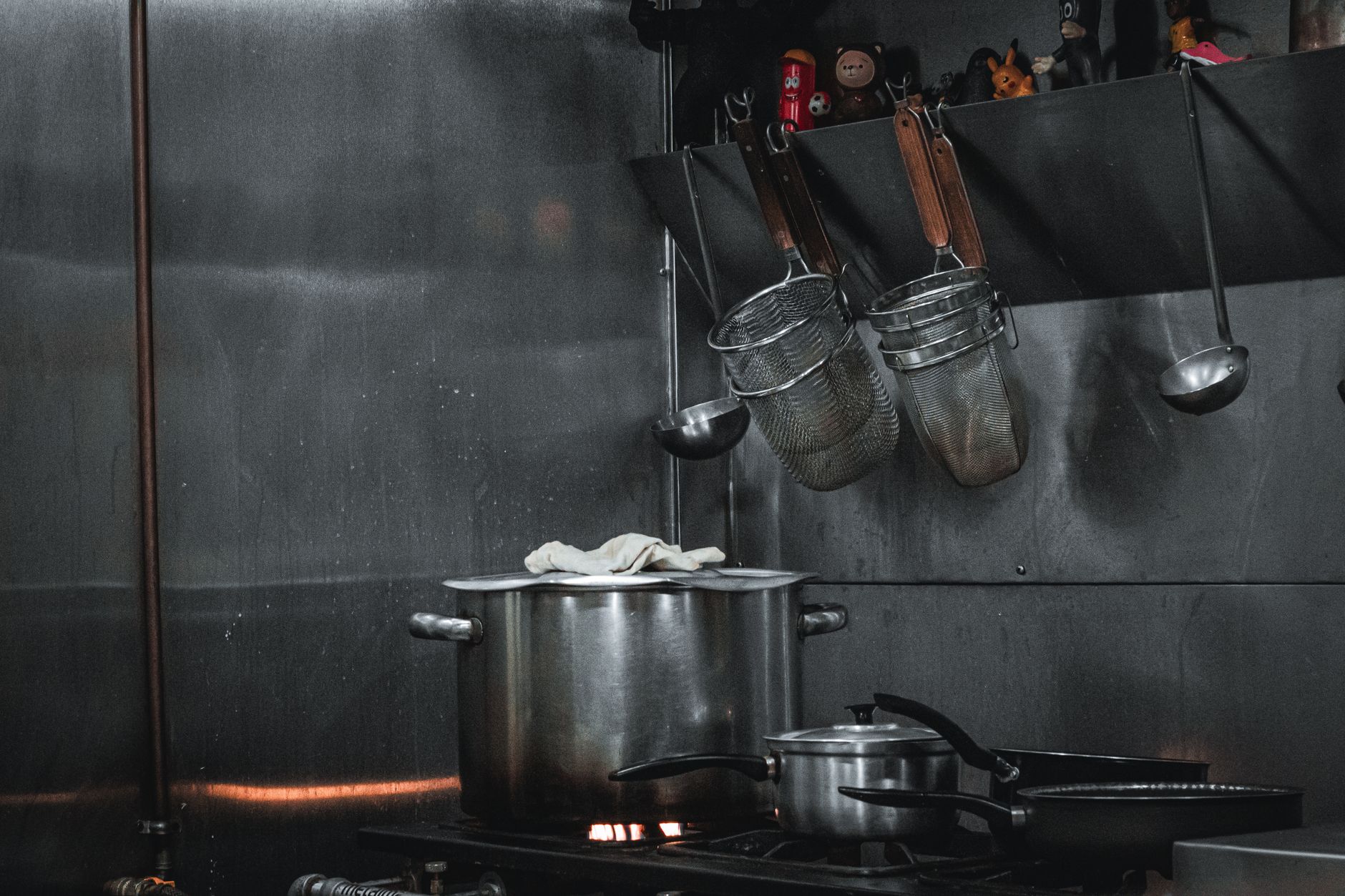 Pots on a stove in a commercial kitchen