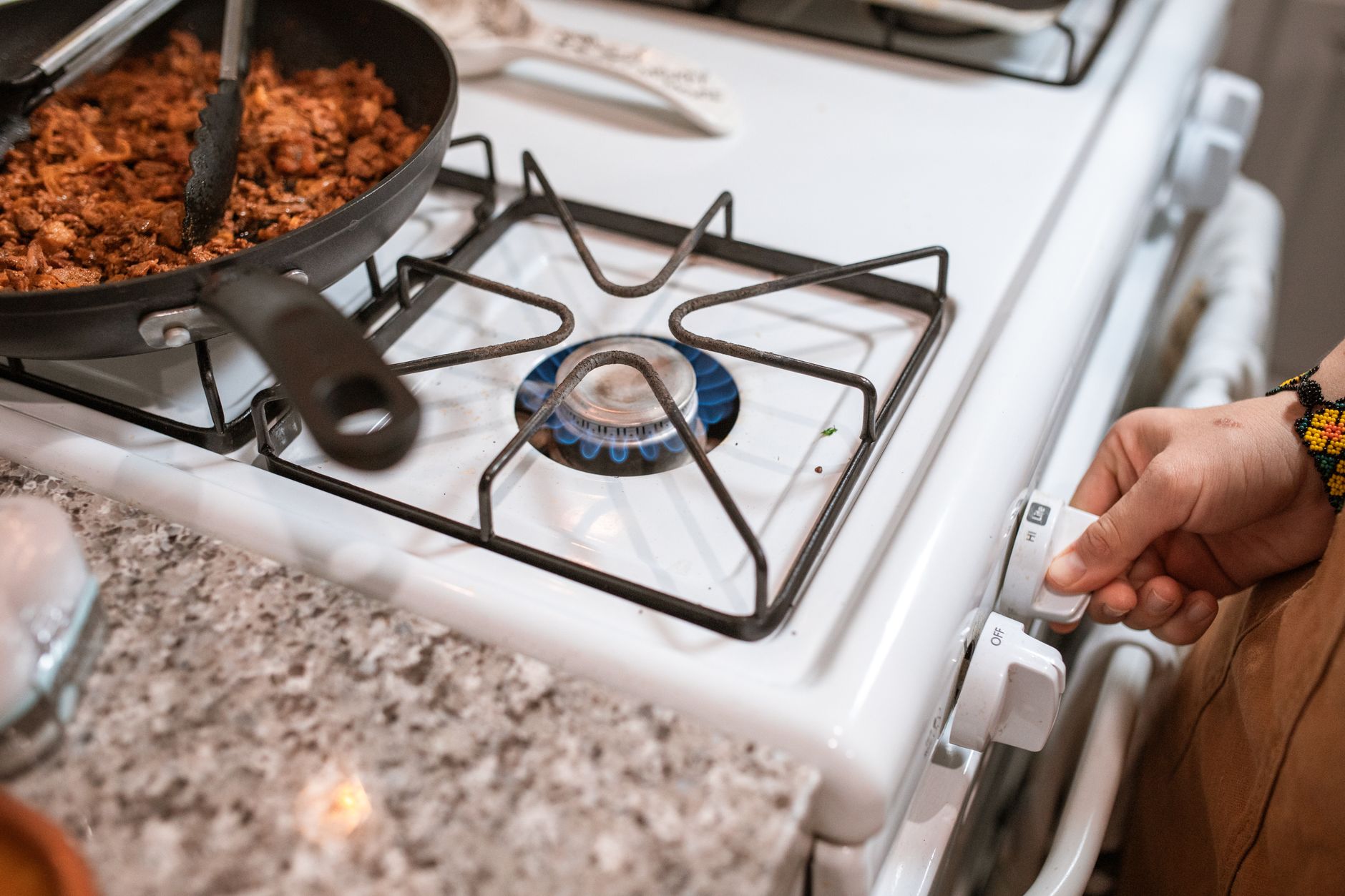 Cooking on a white gas range