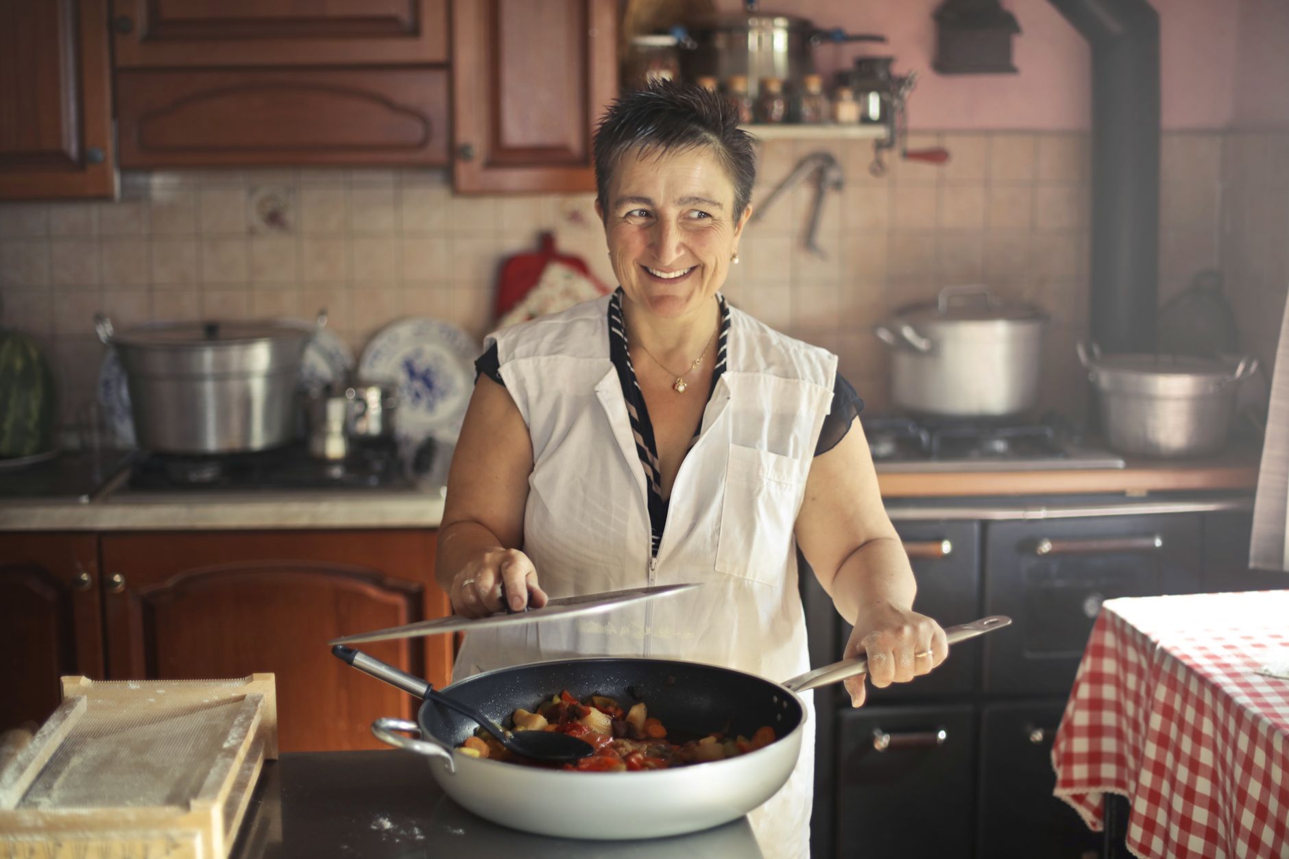 A pan cooking on a kitchen stove