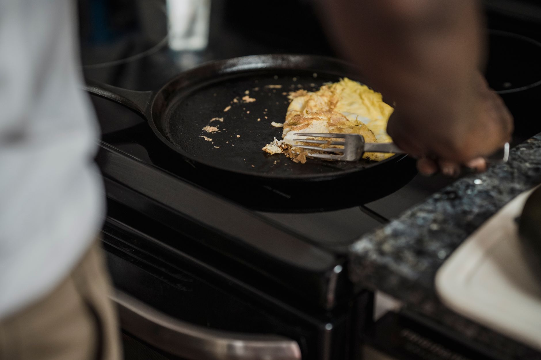 Cooking in a cast iron pan on a stove