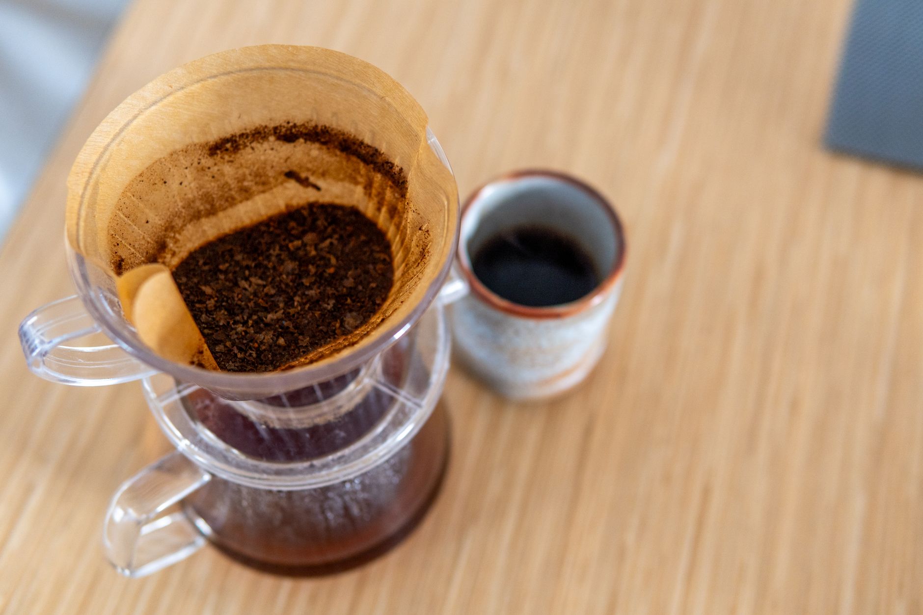 A pour-over dripper with spent grounds