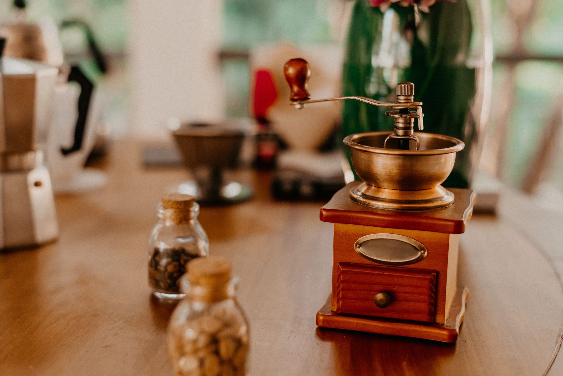 A wooden hand coffee grinder