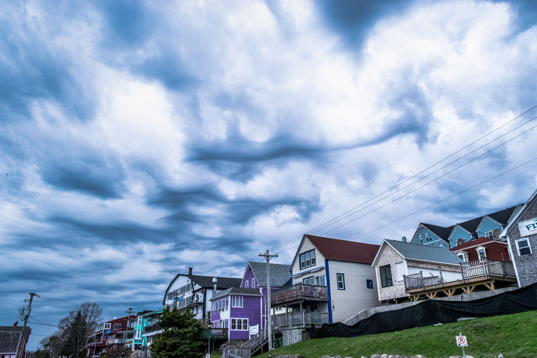 Storm clouds gathering over a house