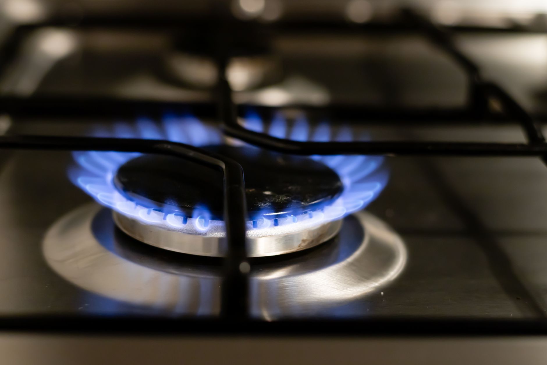 Lit gas stove burner