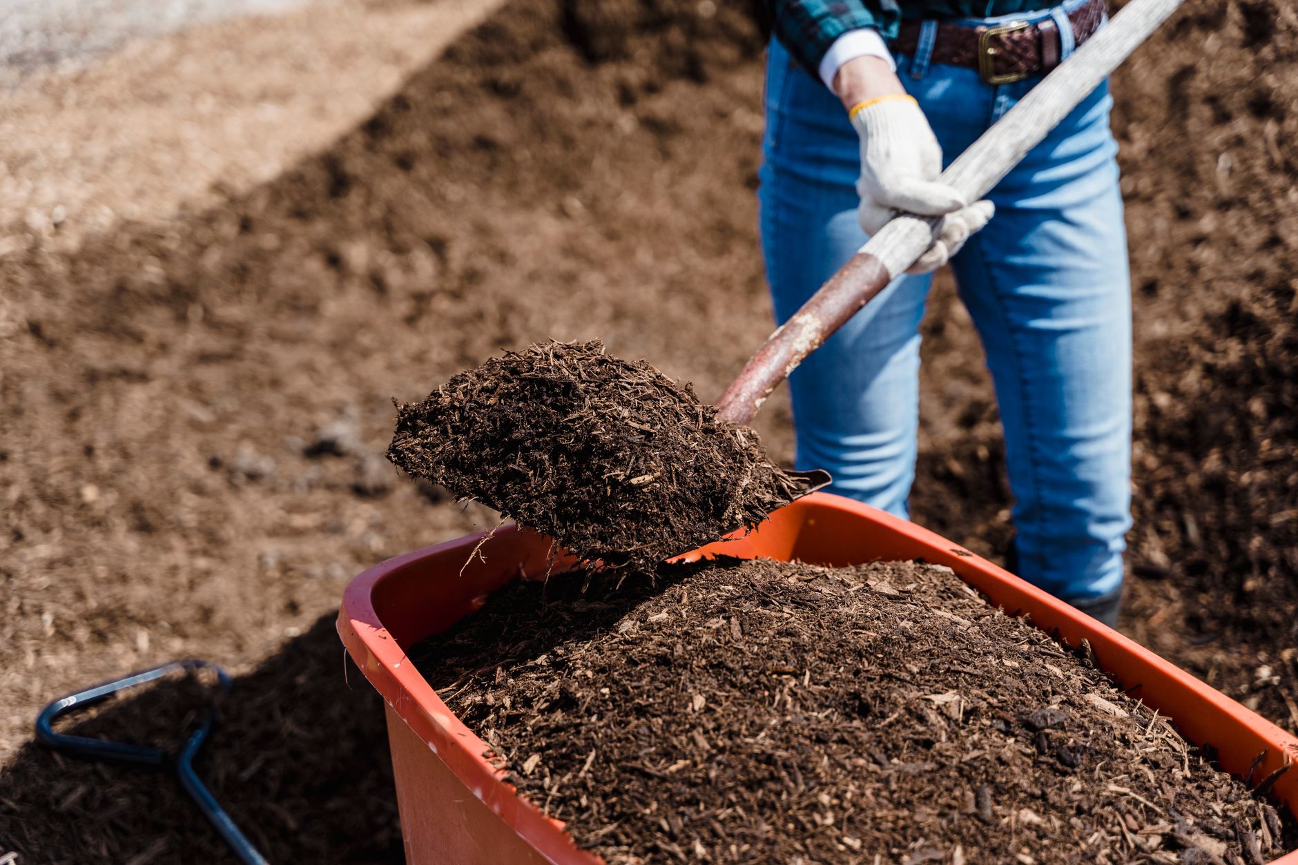 Dark garden soil mixed with compost