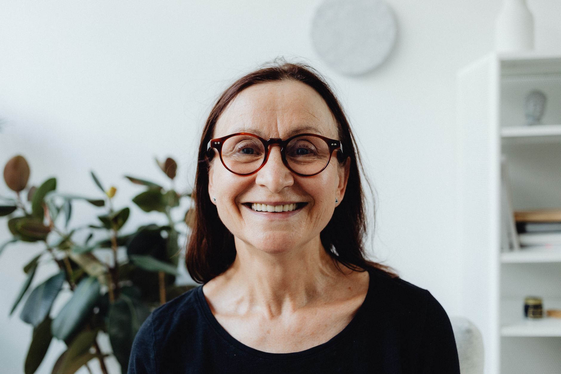 An older woman smiling at home