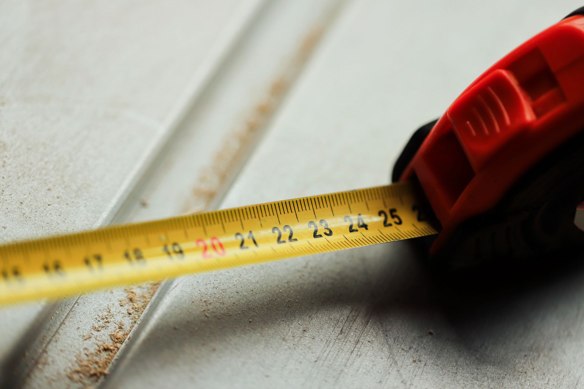 A tape measure on a white surface