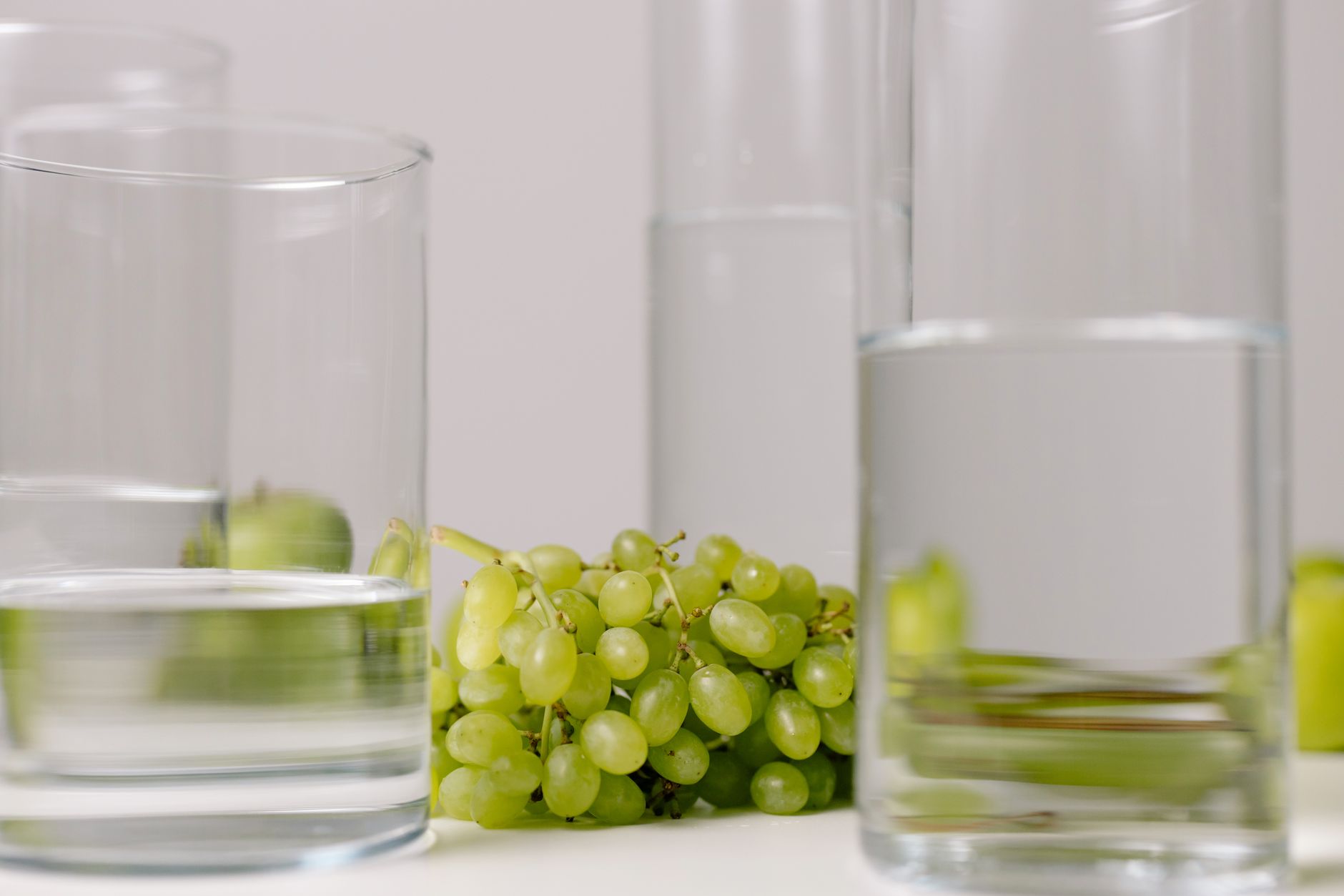Best reverse osmosis water filter: glasses of water with green grapes