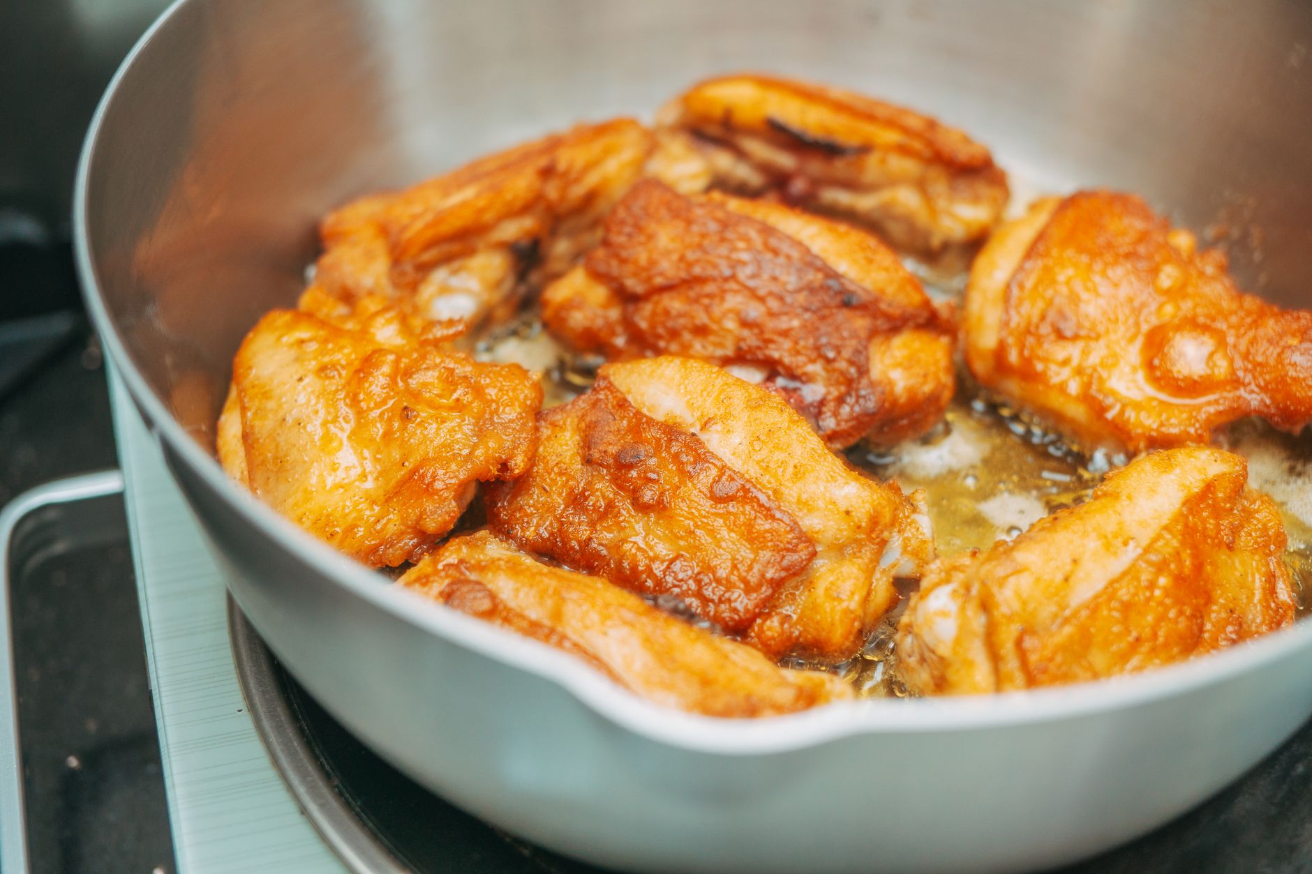 A whole roast chicken in a pan