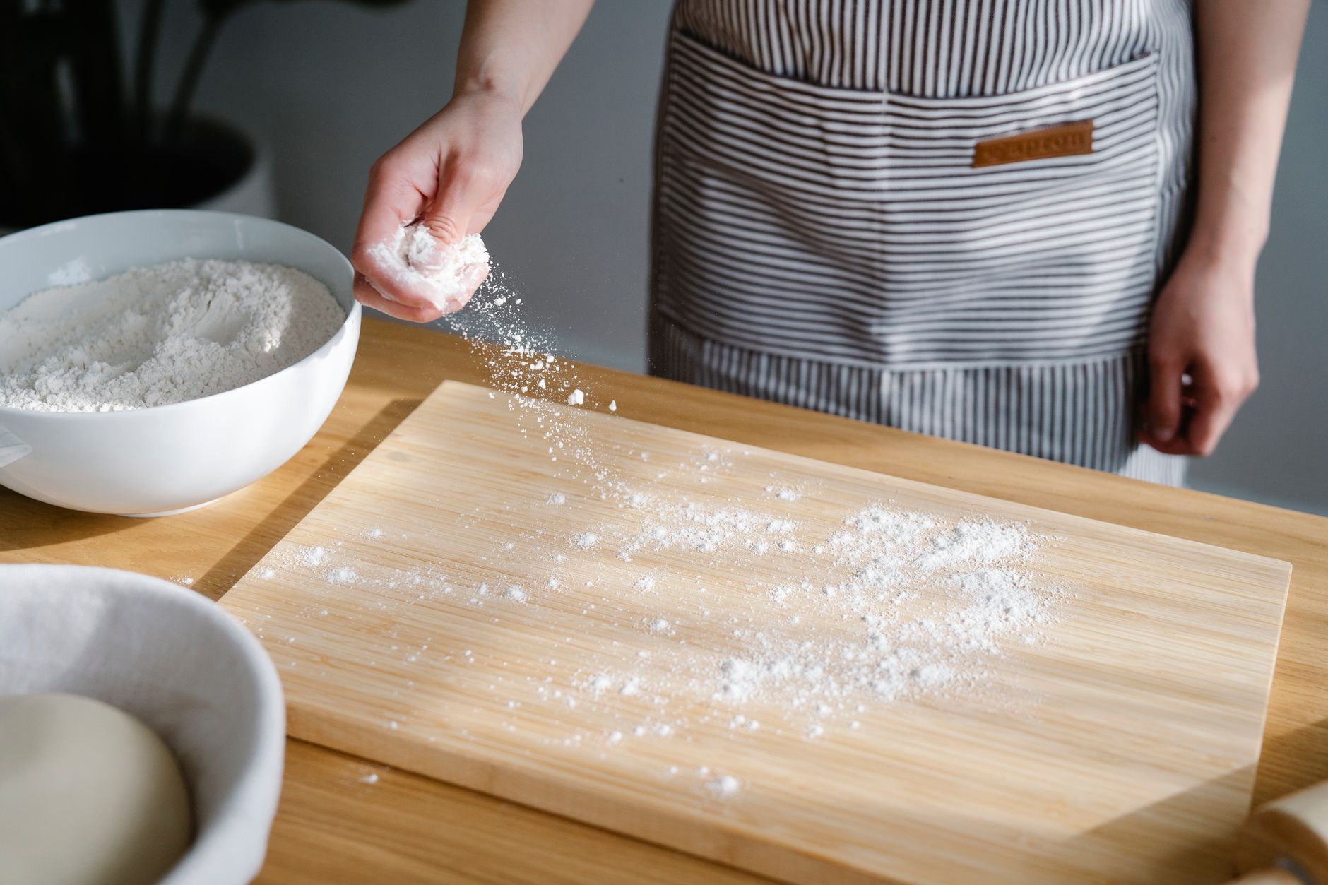 Flour and baking tools on a kitchen counter