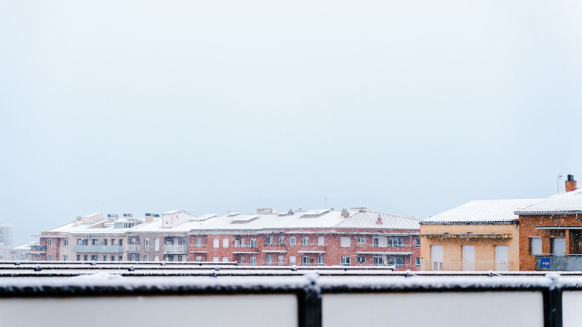 Snow on rooftops on a winter day