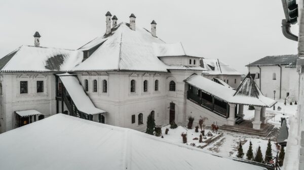 Snow covering the roofs of a large white building