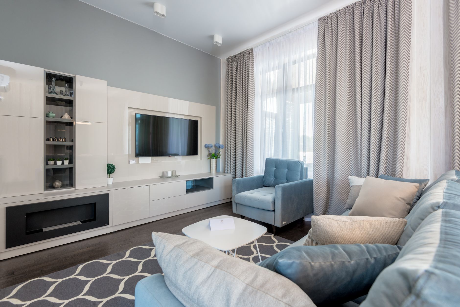 Best rug pad guide: an area rug laid in a bright living room