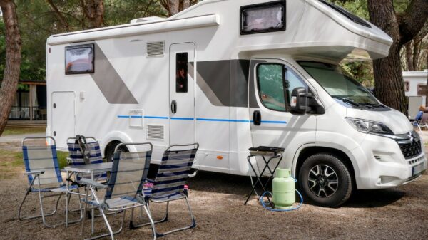 Best rv grill: a motorhome with camp chairs set up
