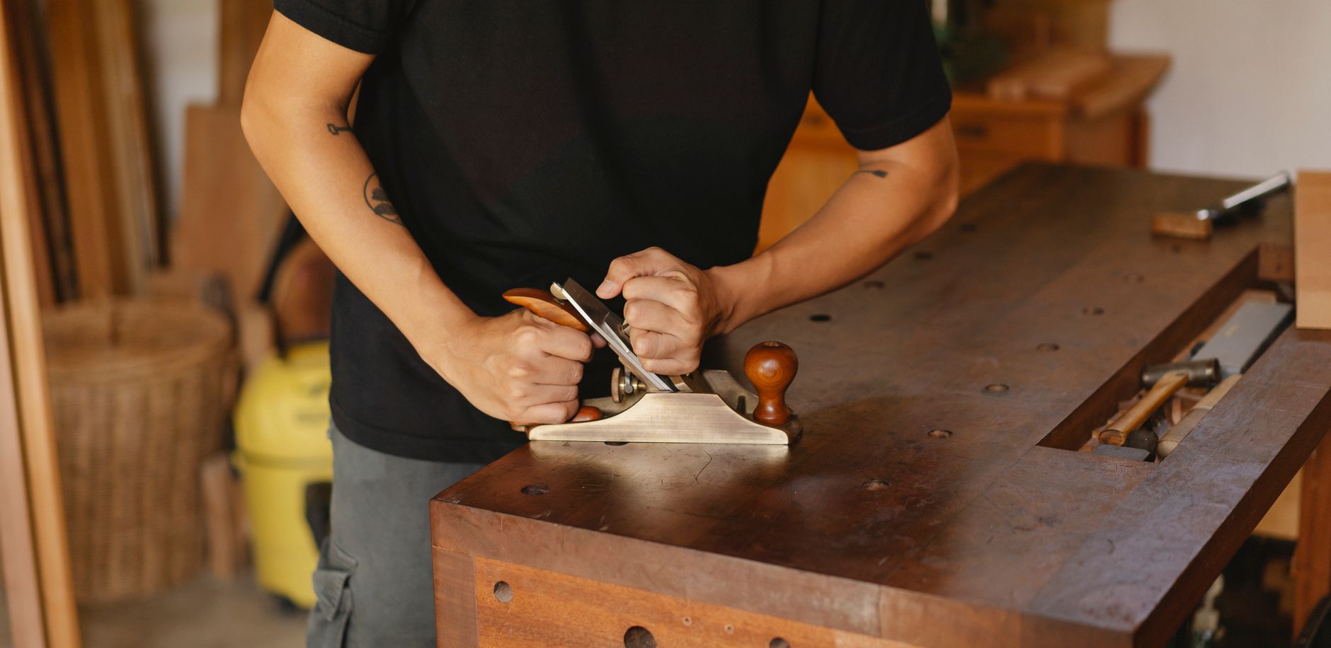 Planing wood on a workbench