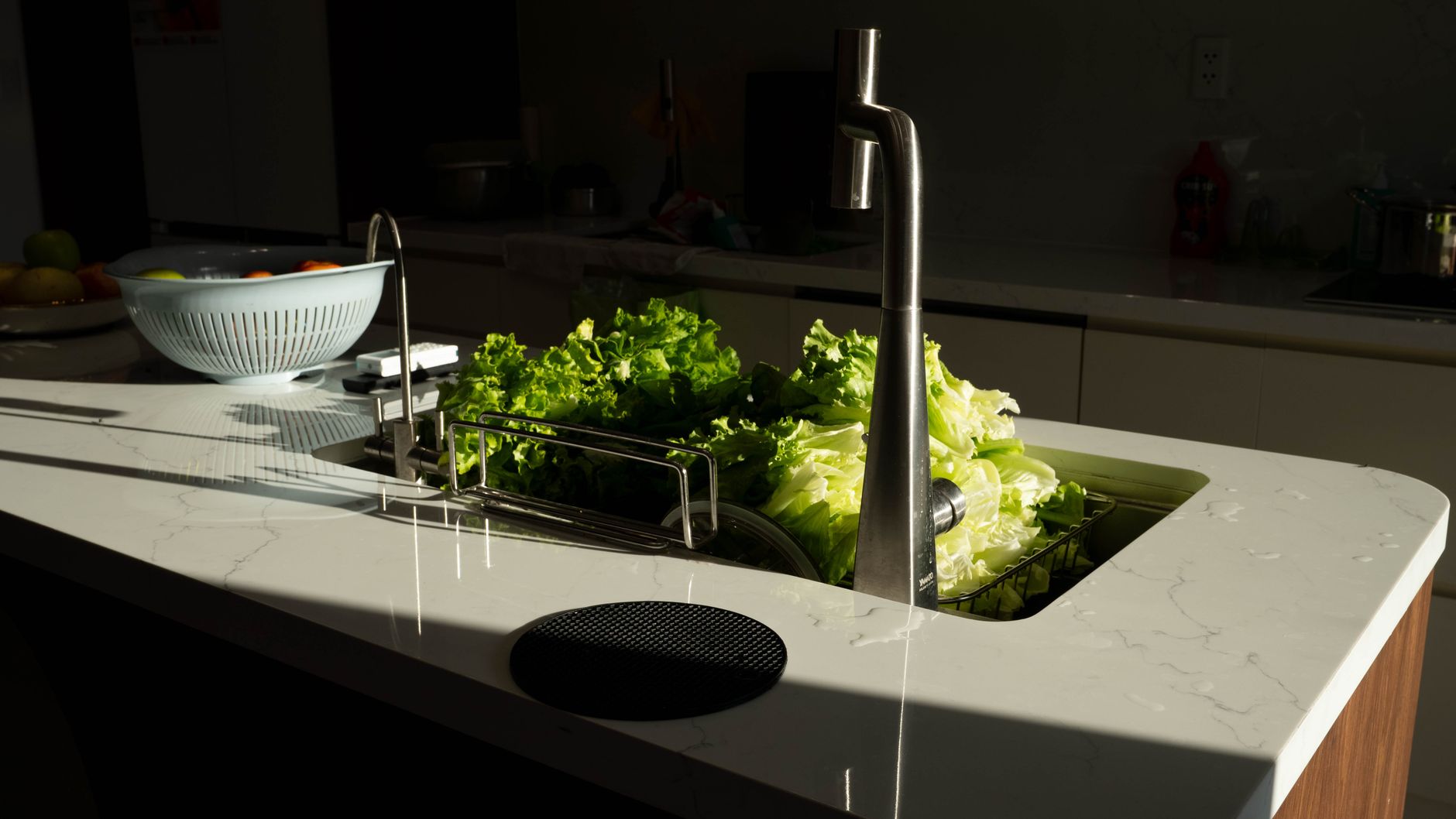 Lettuce rinsing in a kitchen sink