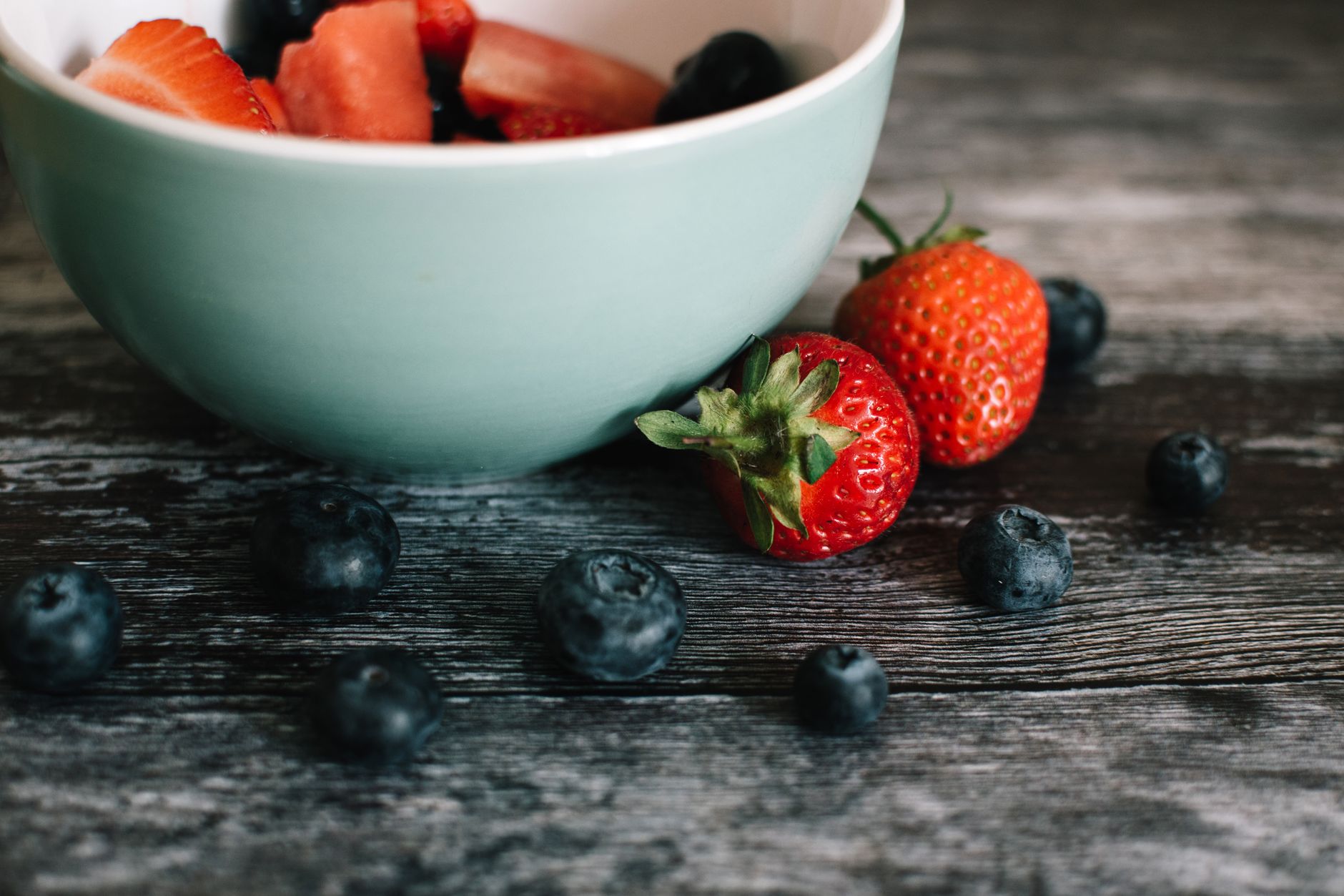 A bowl of strawberries and blueberries