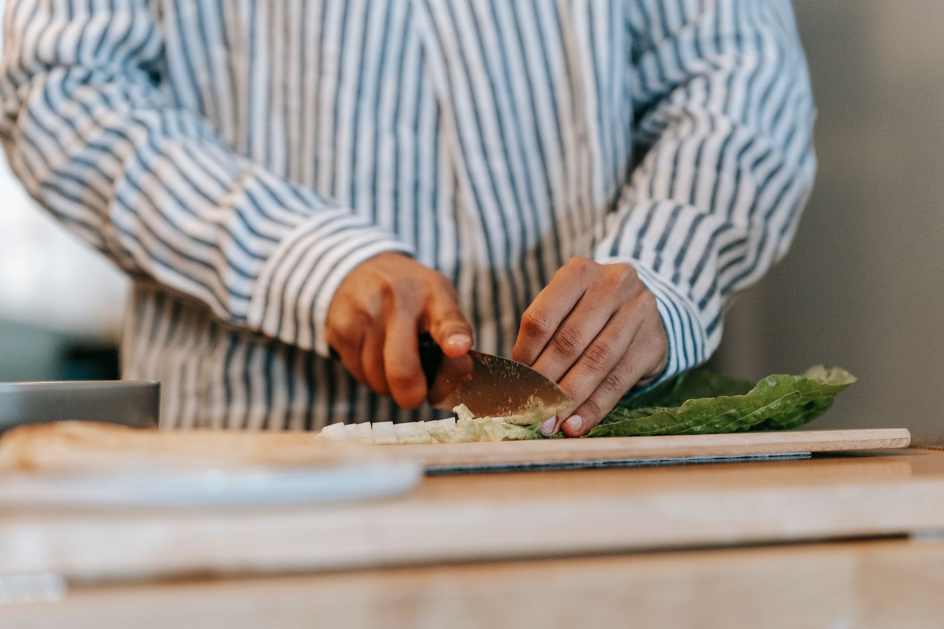 Chopping greens on a cutting board