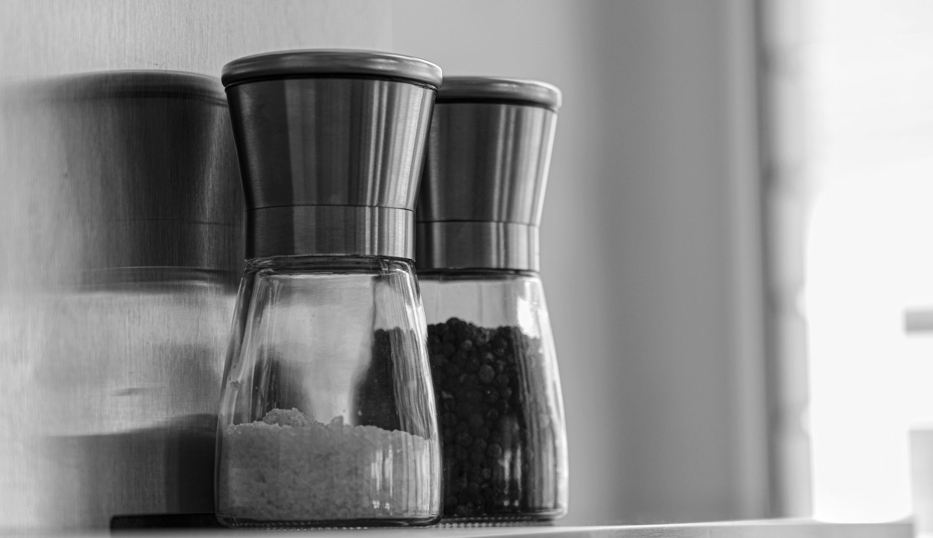 Best salt grinder: salt and pepper mills on a kitchen counter