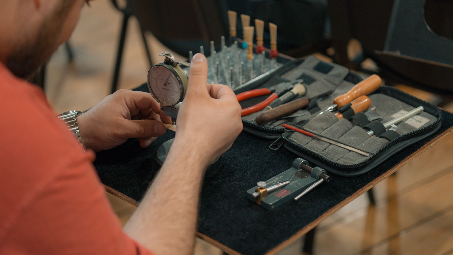 Hand tools arranged on a wooden table