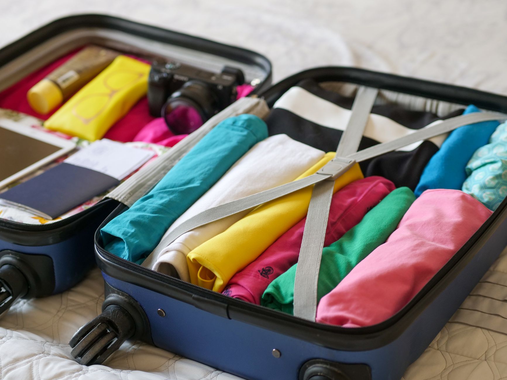 Clothes being packed in a suitcase