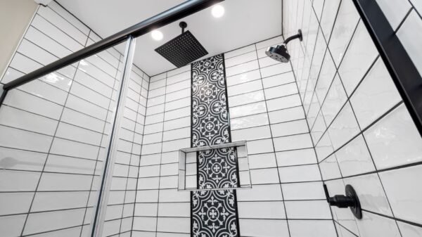 Best shower caddy: a tiled shower with black fixtures