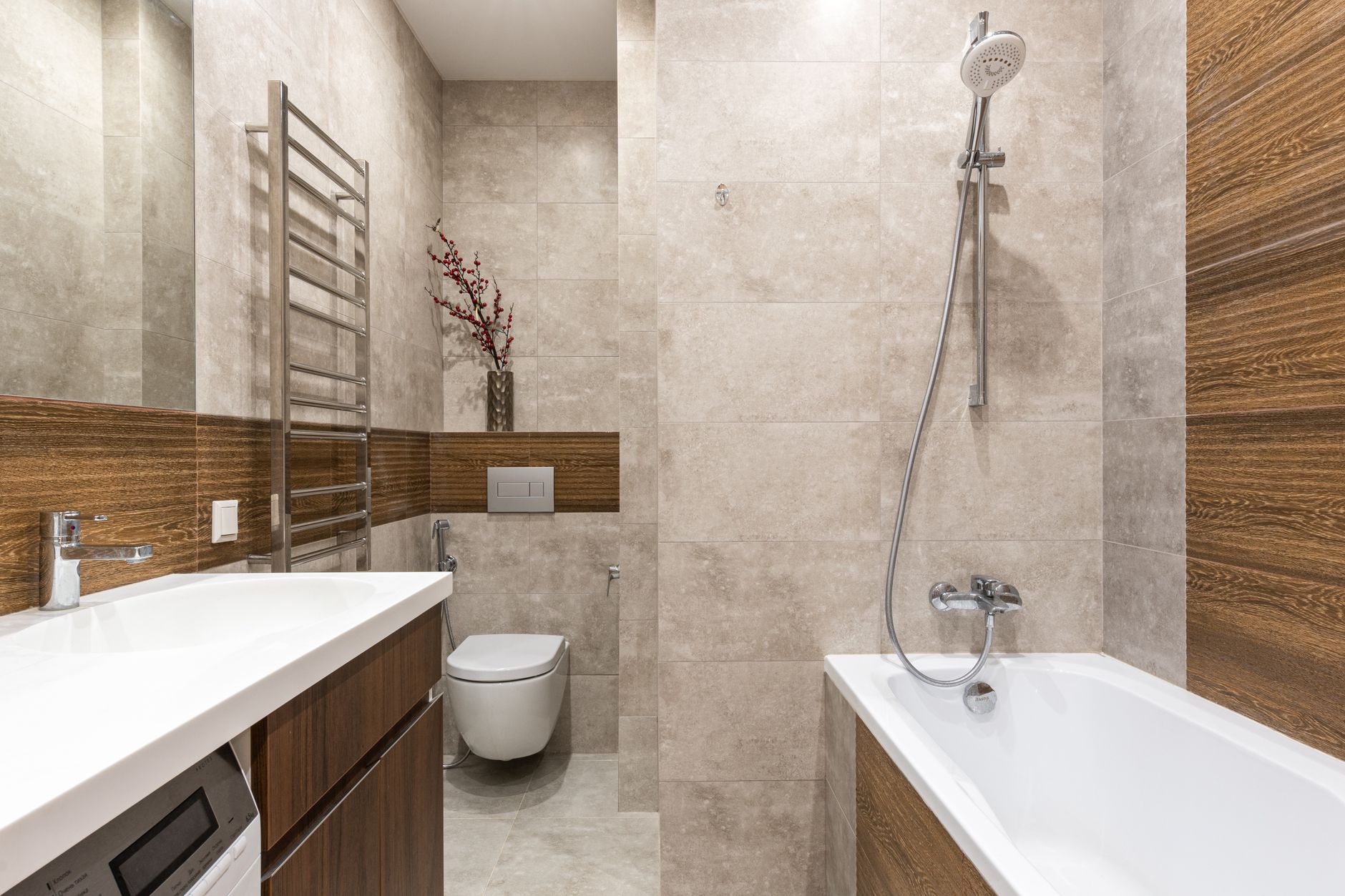 A bathtub with a shower above it