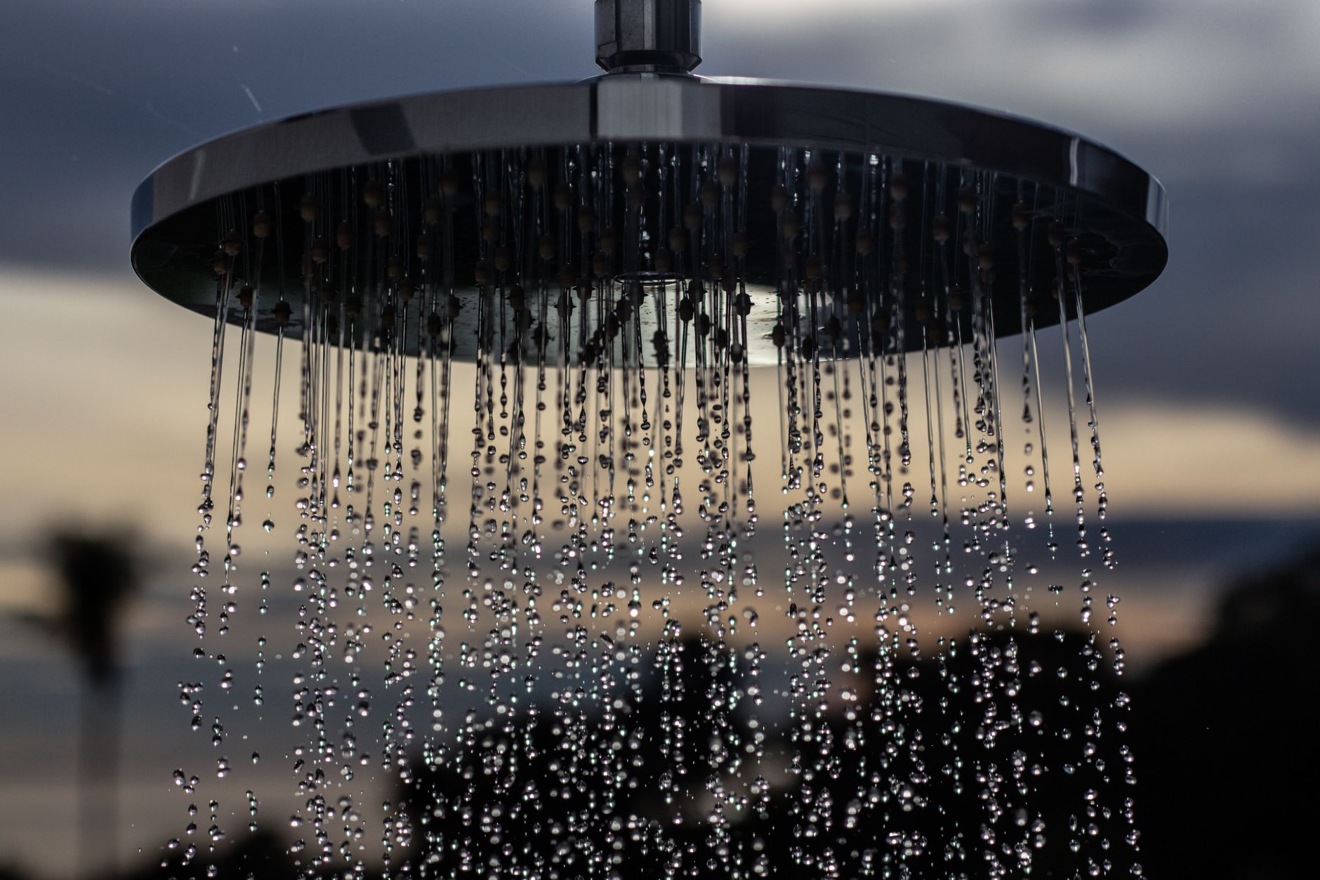 Rain shower head spraying water