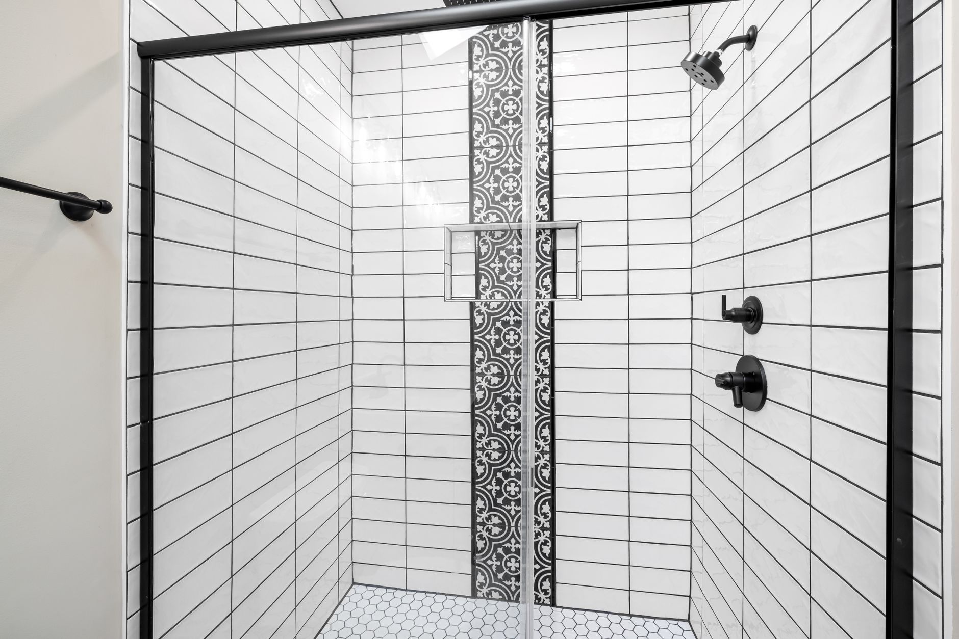 A tiled walk-in shower