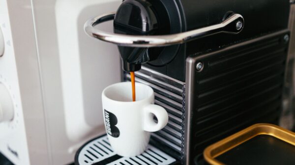 Best single serve coffee maker: a pod machine brewing into a mug