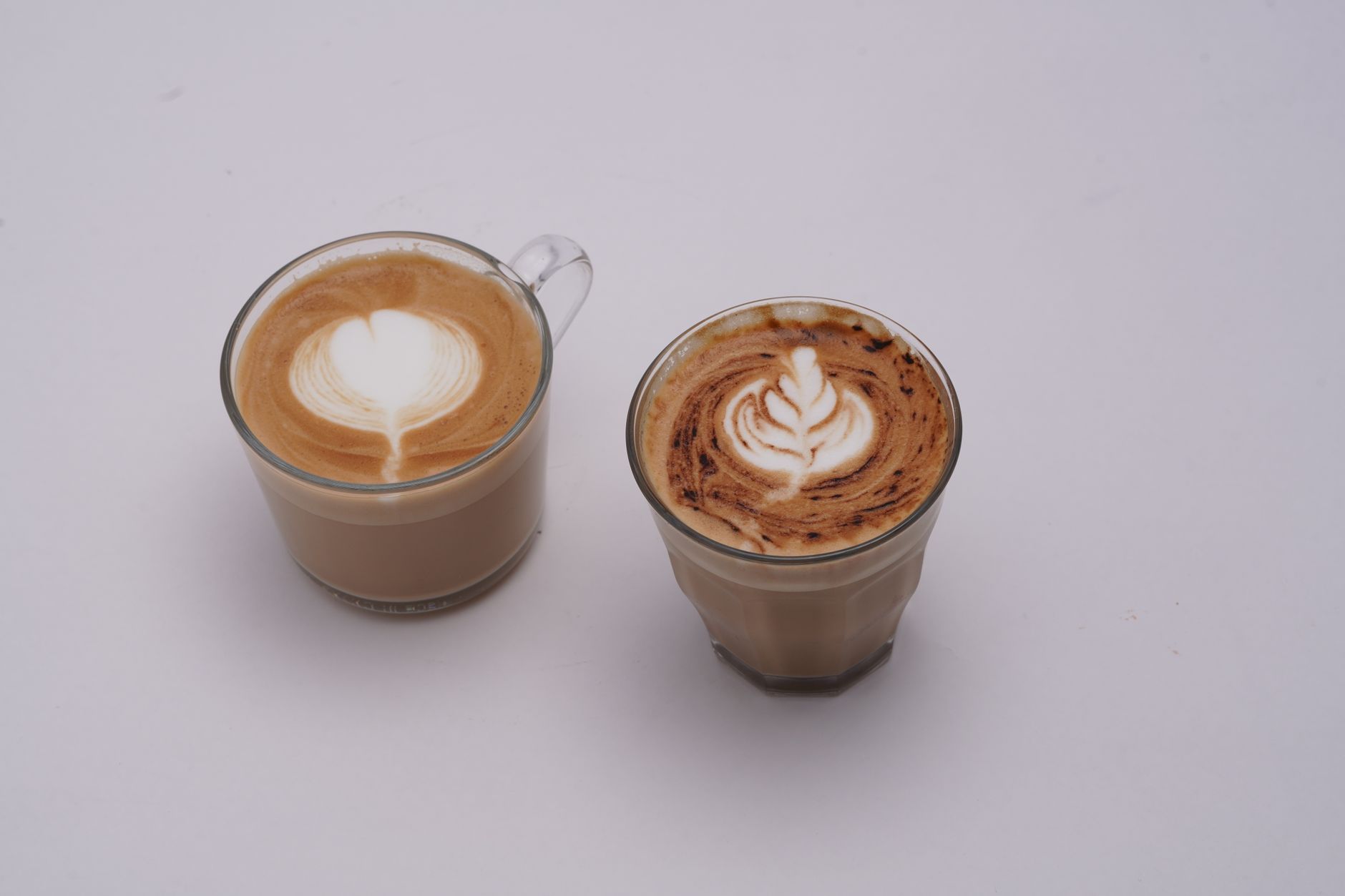 Two cups of coffee with latte art