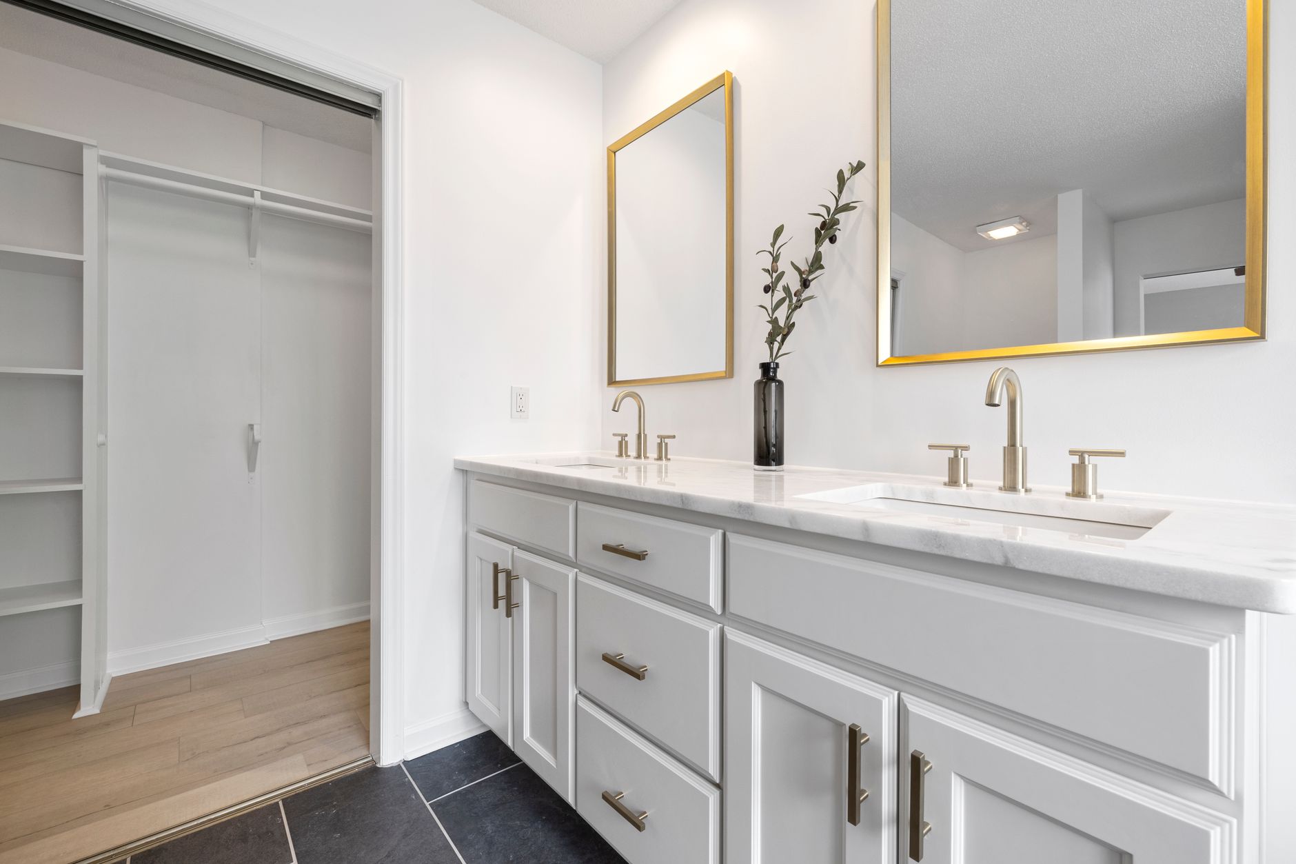 A bathroom vanity with two sinks