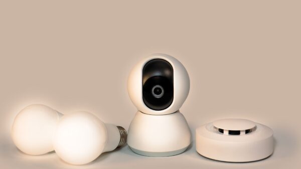 Best smoke detector: a smoke detector beside smart bulbs and a camera