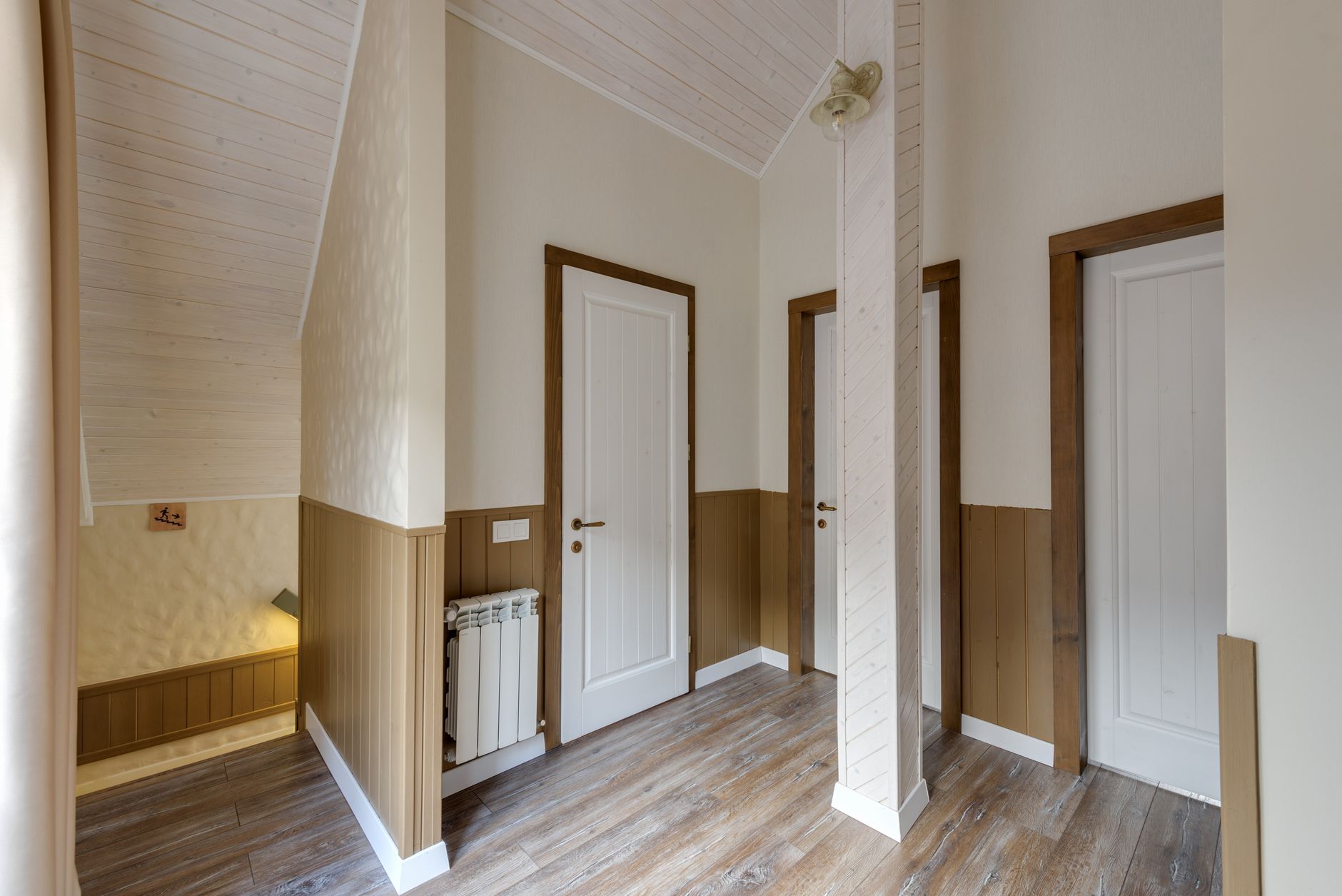 An upstairs hallway with bedroom doors
