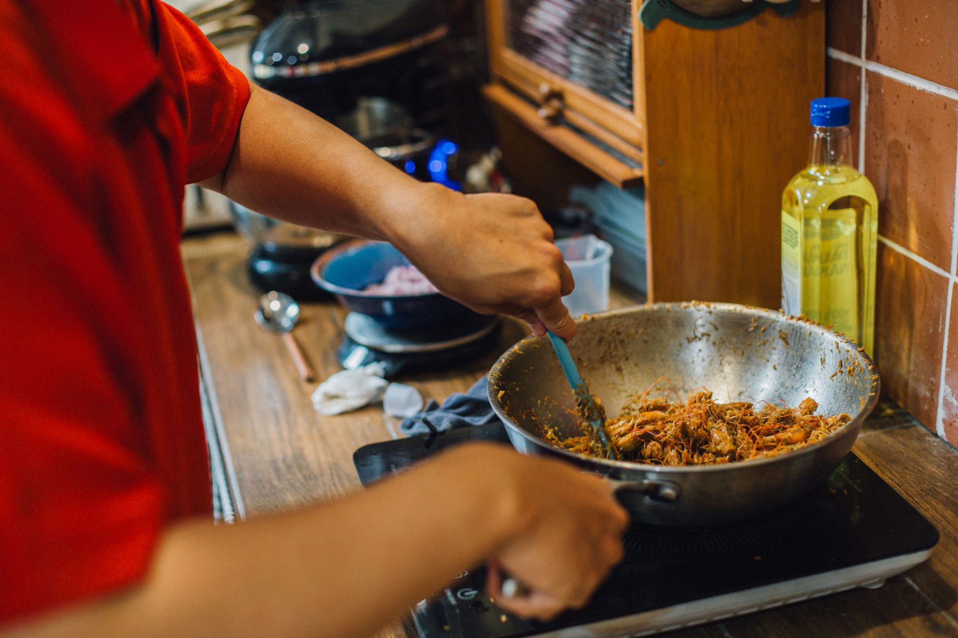 Stir-frying in a pan on an induction burner