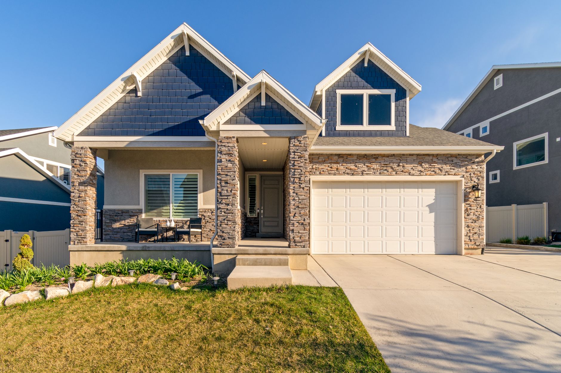 A two-story house with a stone front