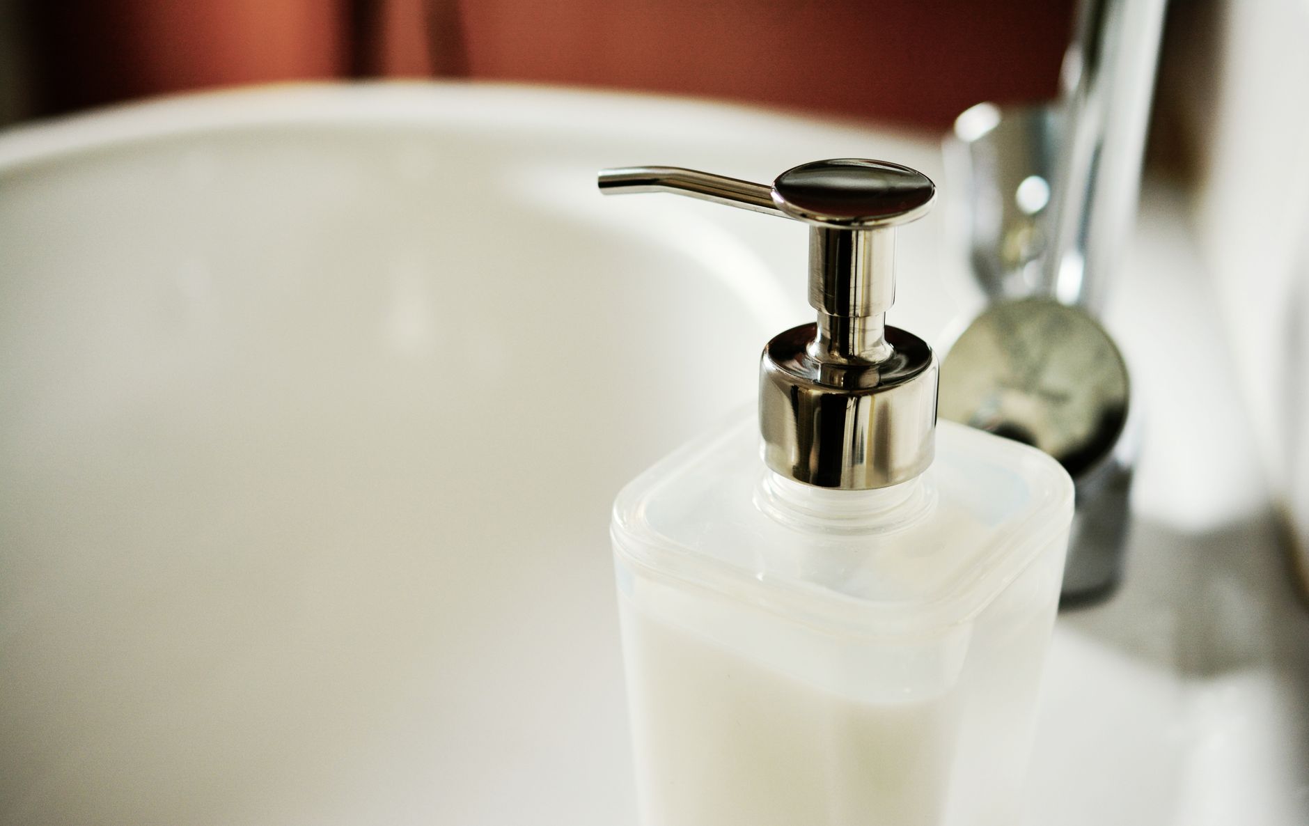 Best soap dispenser: a pump dispenser beside a bathroom sink