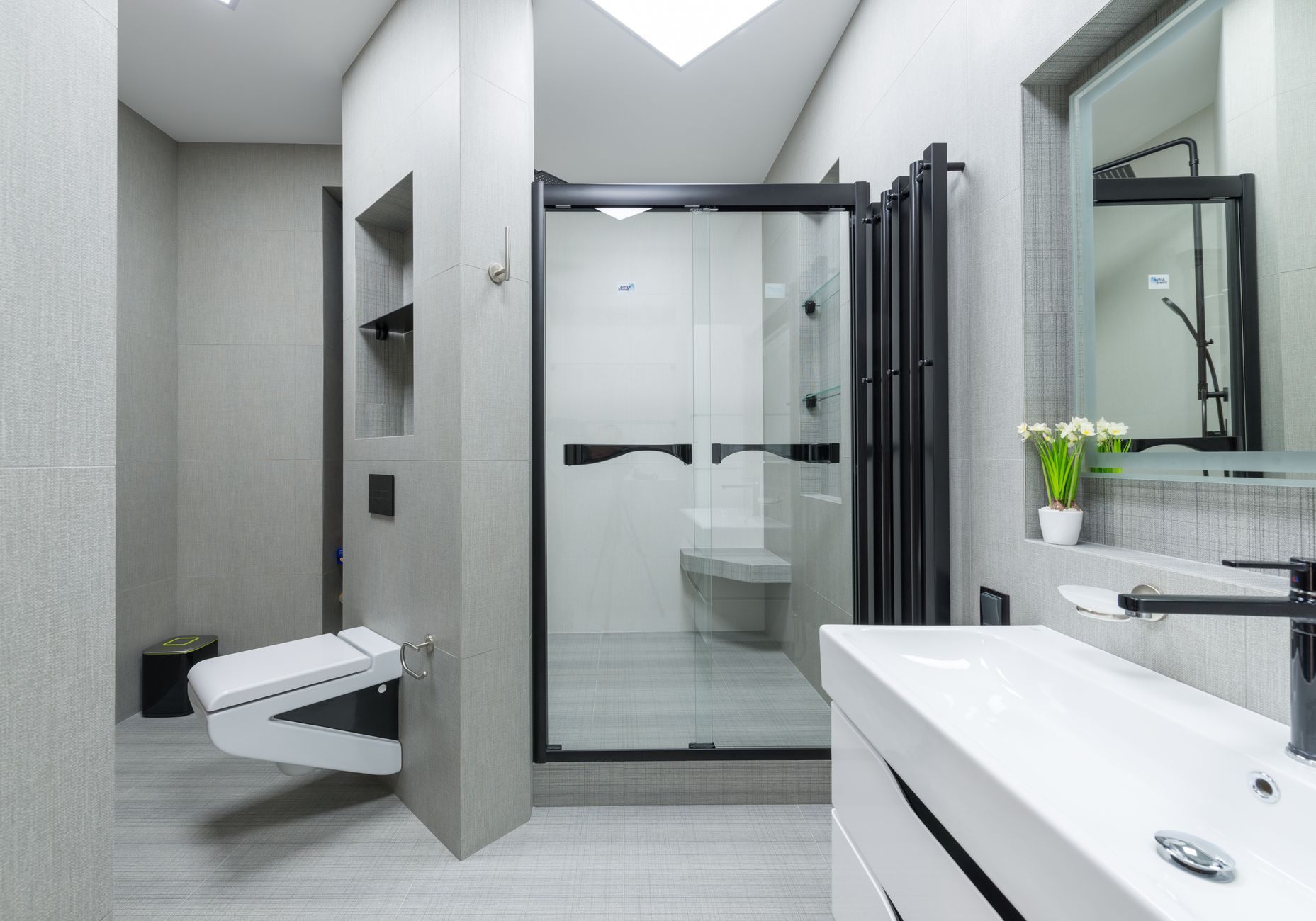 A modern bathroom with a glass shower