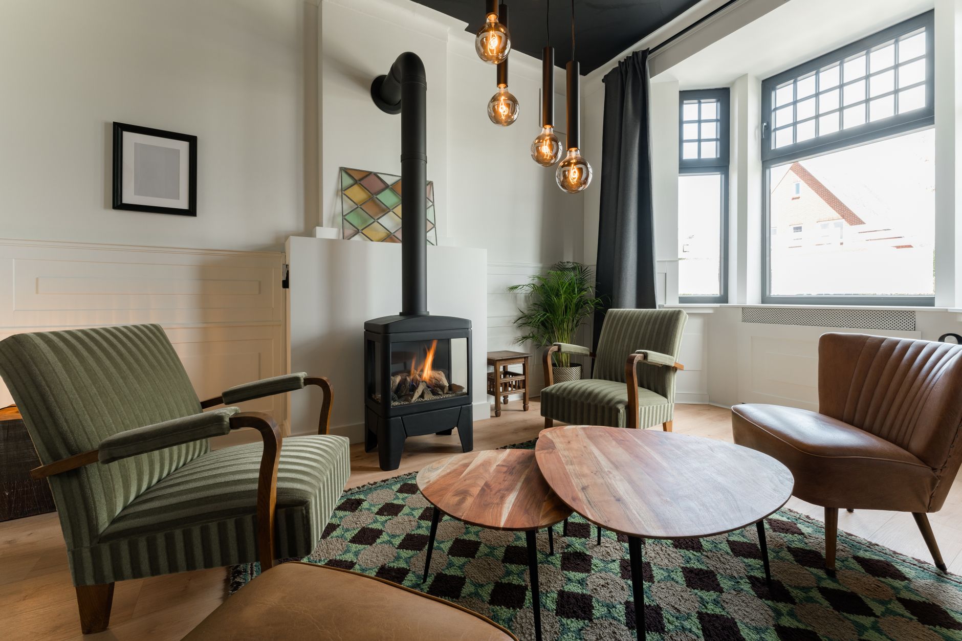 Armchairs by a wood stove in a living room