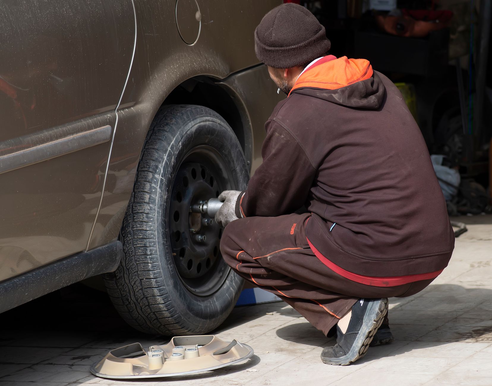 A wheel being removed during a tire change