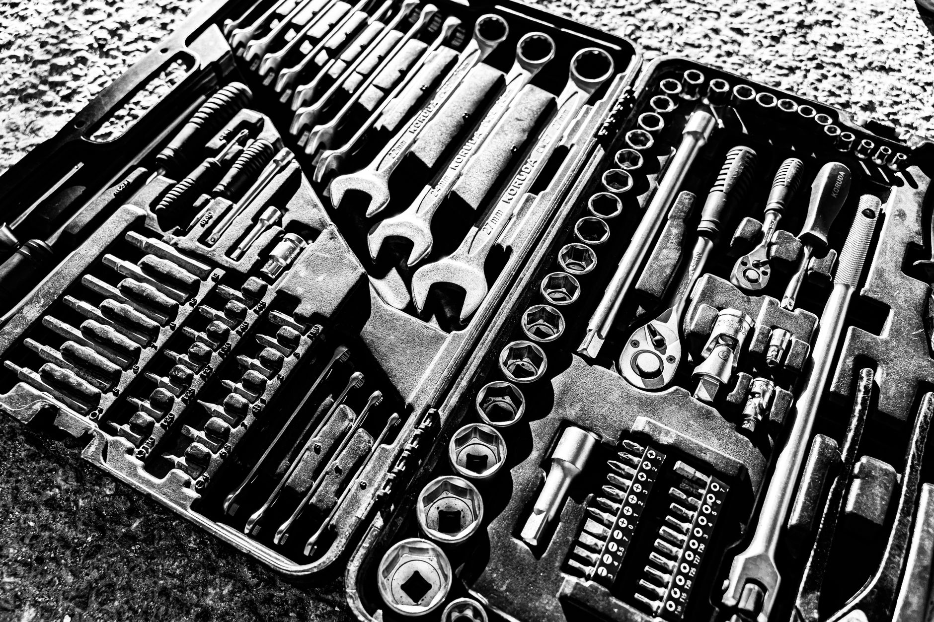 An open toolbox filled with hand tools