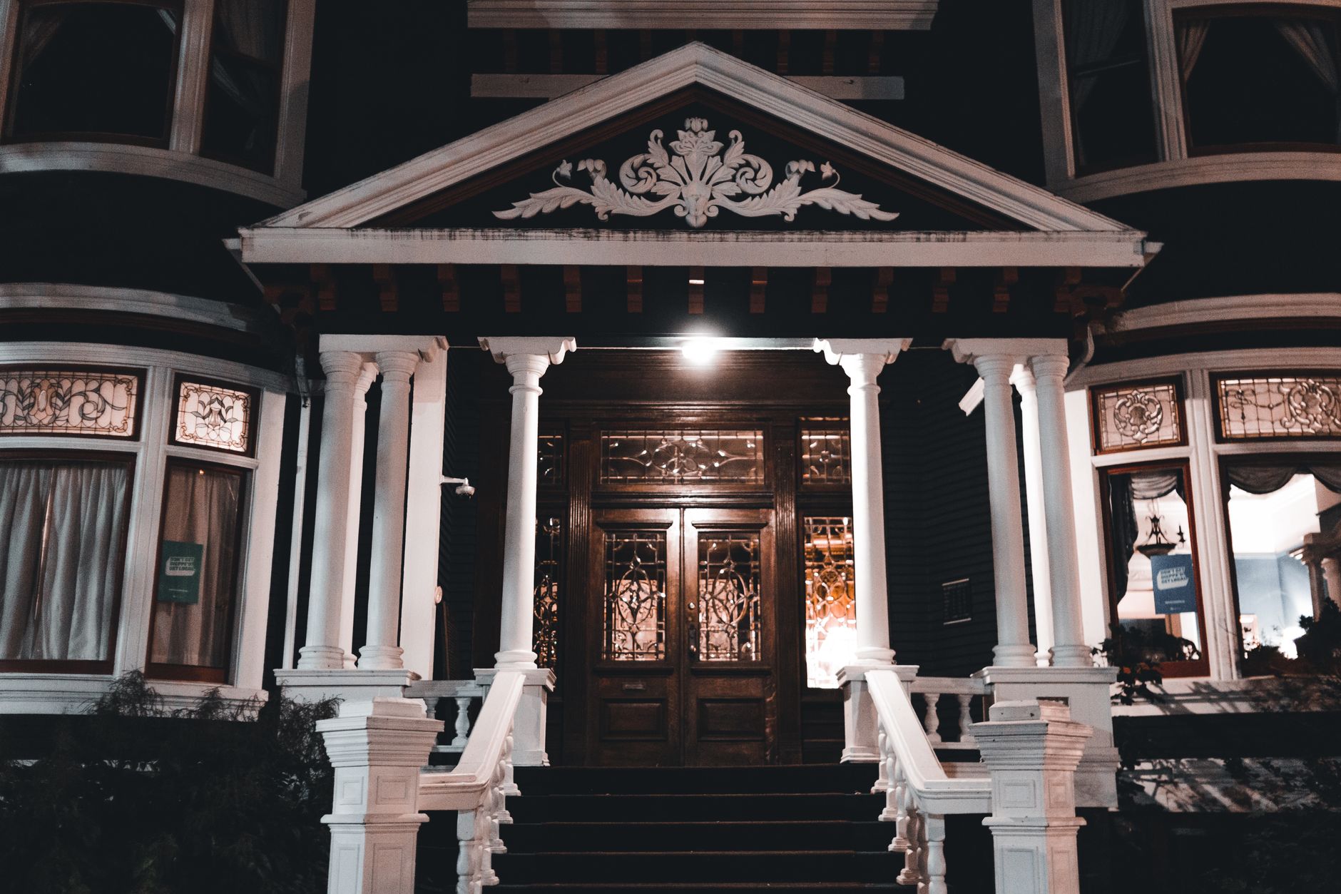 The front porch of a house lit at night